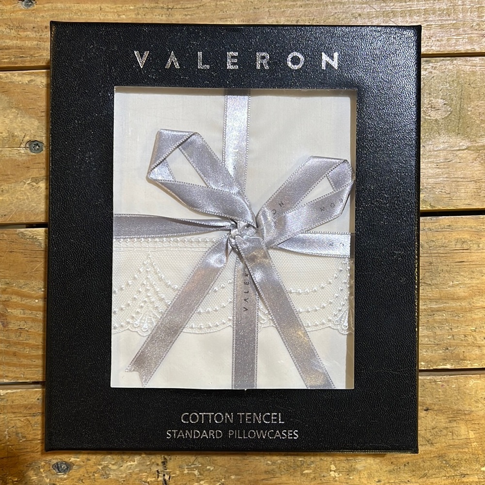 2 white pillowcases by Valeron.  Beautiful wedding gift